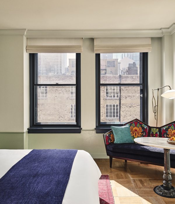 Studio Suite bedroom and couch with views of the city