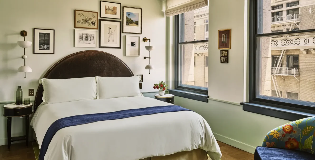 City view study bedroom, bed with side table and couch