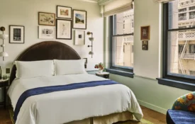 City view study bedroom, bed with side table and couch