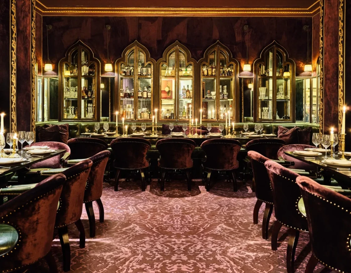 Velvet chairs and candlelight set an opulent mood at one of the top Italian restaurants in Los Angeles.
