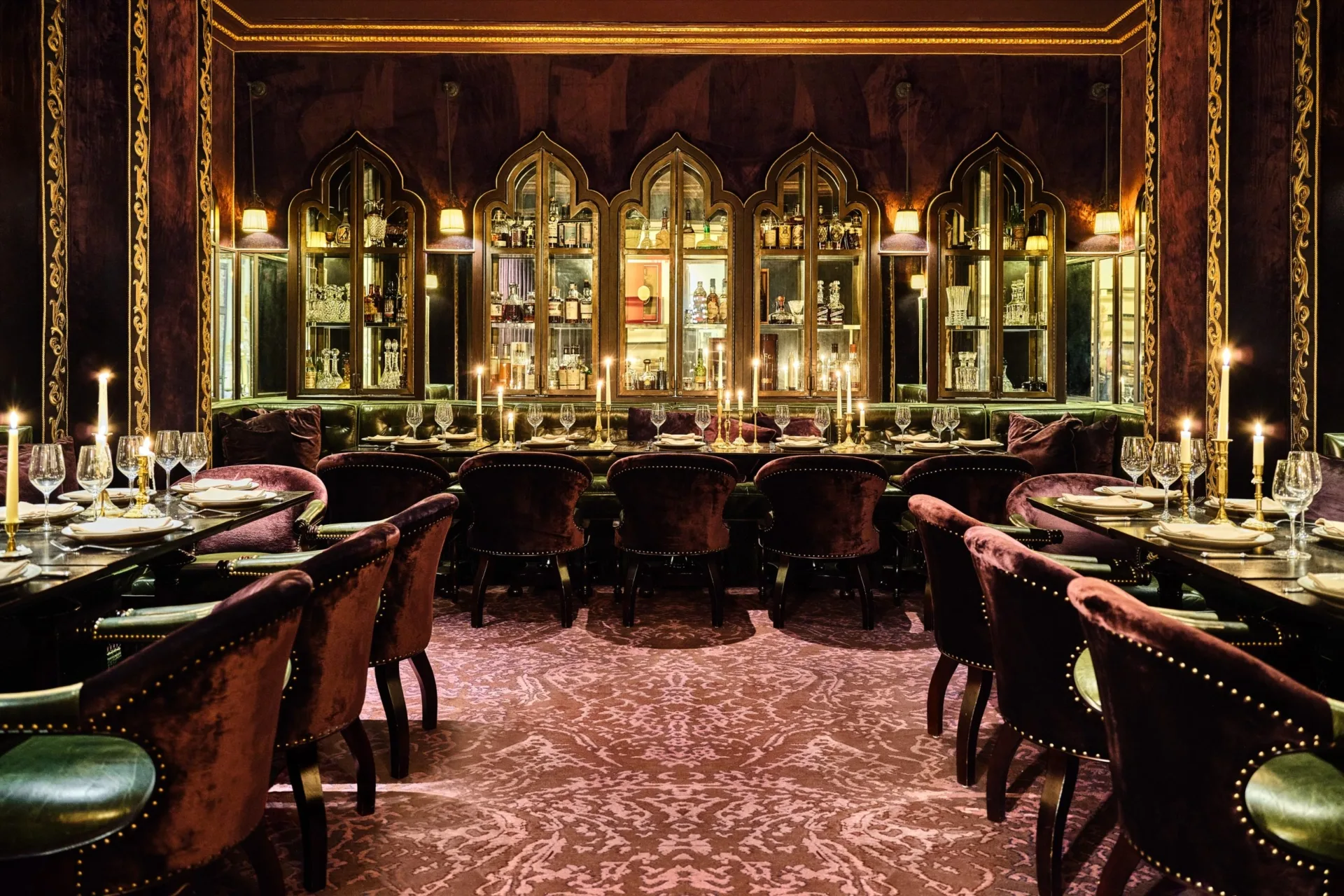 Velvet chairs and candlelight set an opulent mood at one of the top Italian restaurants in Los Angeles.
