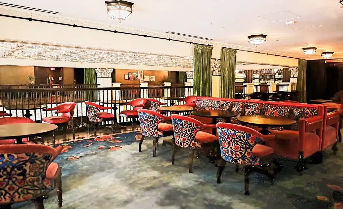 Ornate patterned chairs and red velvet sofas provide elegant seating at Ristorante Per L'Ora in Downtown LA.