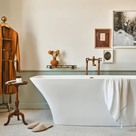 A freestanding white bathtub sits in a luxury hotel suite at Hotel Per La in downtown Los Angeles.