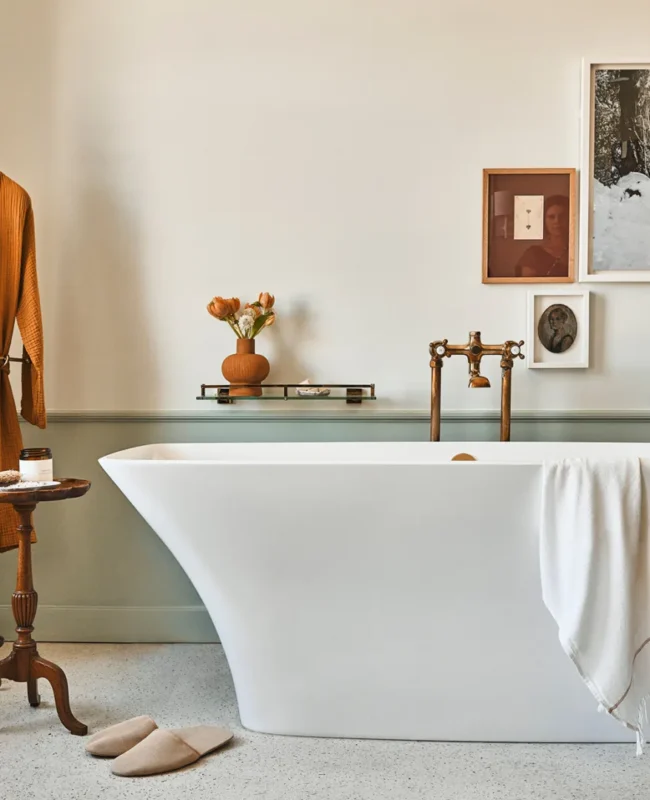 A freestanding white bathtub sits in a luxury hotel suite at Hotel Per La in downtown Los Angeles.