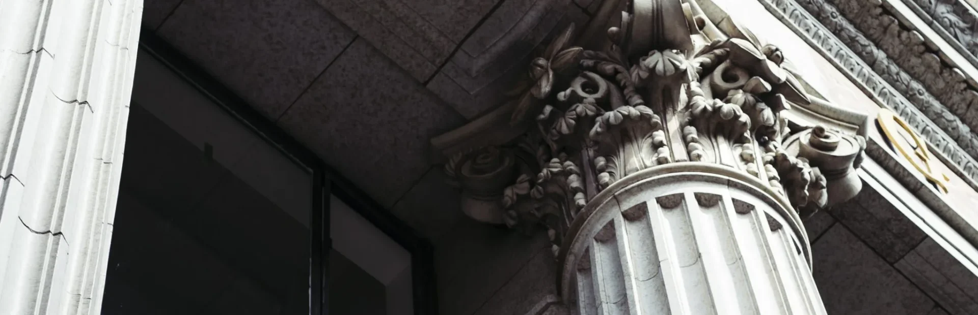 Intricate Corinthian columns and stone carvings decorate the exterior of this luxury boutique hotel in Los Angeles.