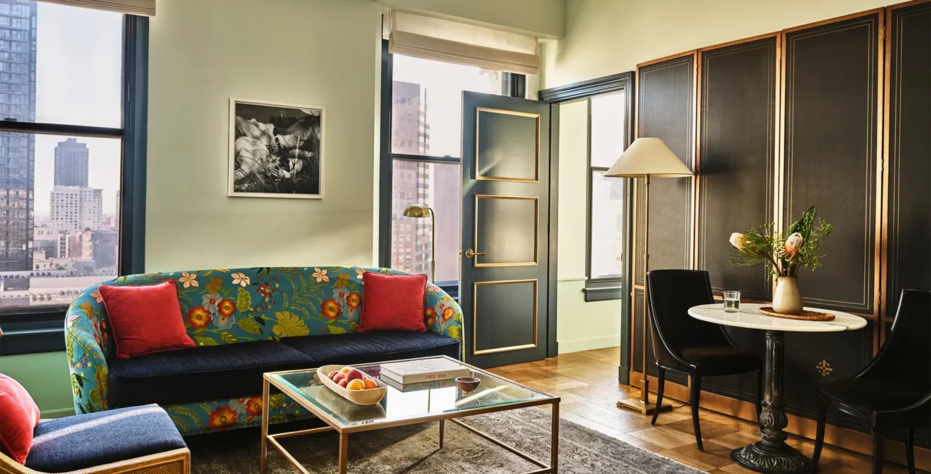 A glamorous living area in a hotel suite with views of LA