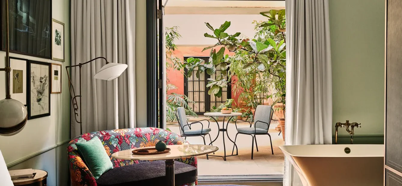 Patio Salon. Bedroom with doors oped to the patio area.