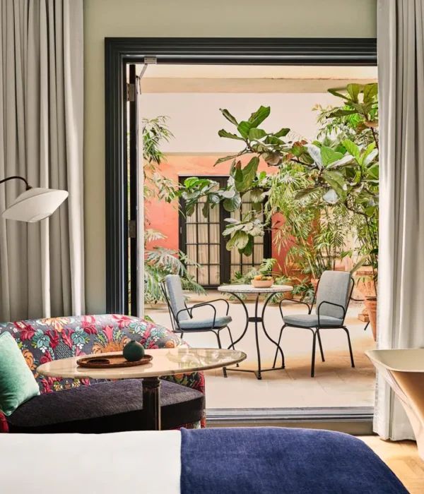 Patio Salon. Bedroom with doors oped to the patio area.