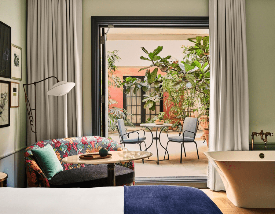 Patio Salon. Bedroom with doors oped to the patio area.