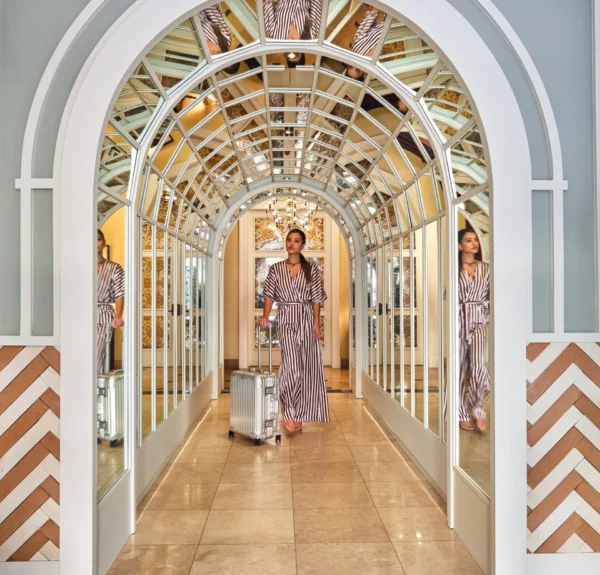 Lifestyle photo of person walking with suitcase
