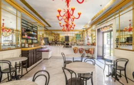 Marble tables and red chandeliers define the elegant Cafe Ora at this boutique hotel in Los Angeles.