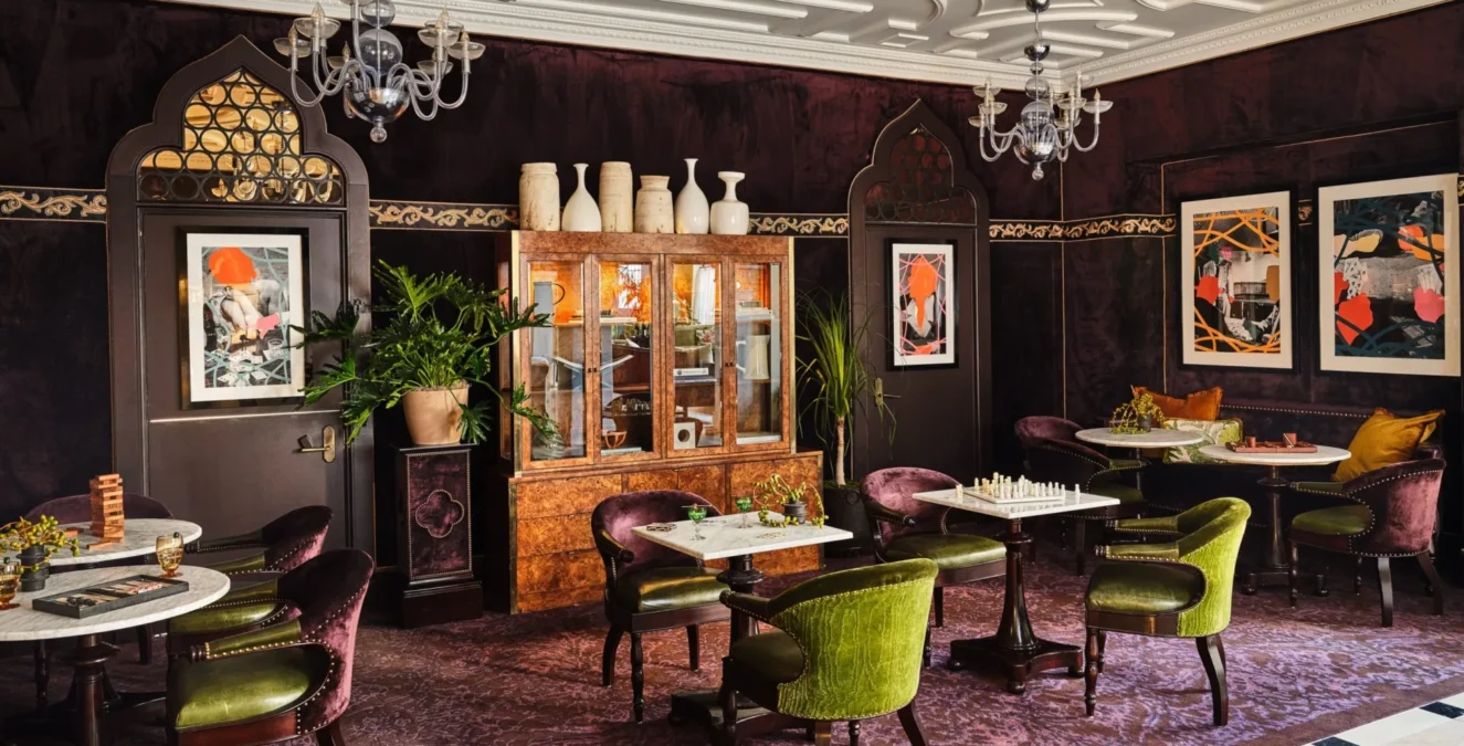 Plush velvet seating and marble game tables offer a sophisticated escape at this boutique hotel in Los Angeles.