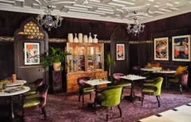 Plush velvet seating and marble game tables offer a sophisticated escape at this boutique hotel in Los Angeles.