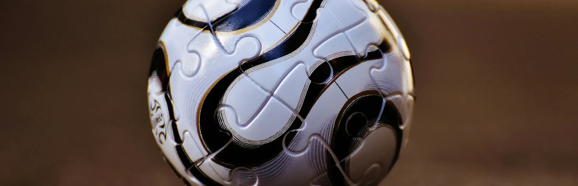 a soccer ball sitting on top of a wooden floor