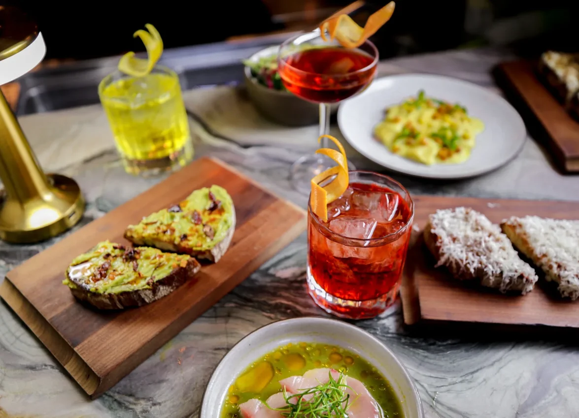 Vibrant cocktails and authentic Italian dishes create an inviting spread at Ristorante Per L'Ora in downtown LA.