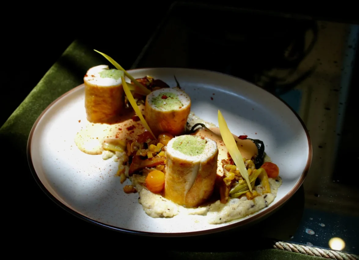 An exquisitely plated stuffed chicken breast served with vegetables at Ristorante Per L'Ora in downtown LA.