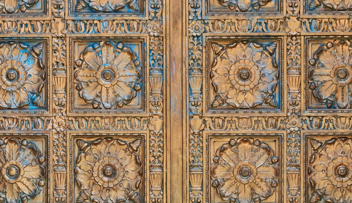 Intricate floral patterns are carved into ornate bronze doors at this boutique hotel in Los Angeles.